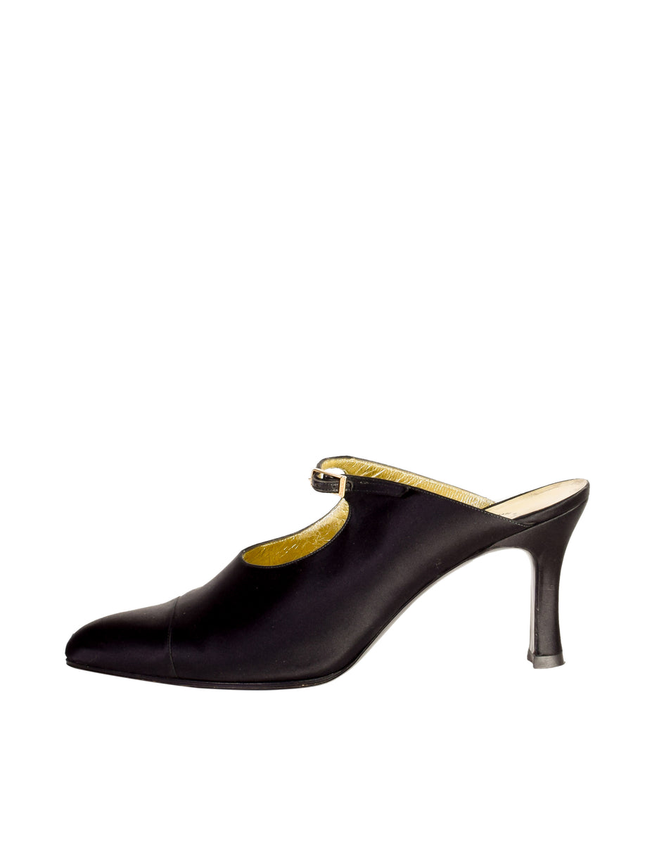 Vintage Chanel black satin mary jane mule heels photographed on a white background.
